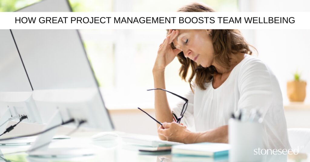 Woman looking stressed at her desk